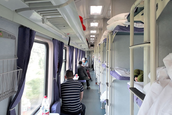  Above the window in hard sleeper cabin, you can find selves for luggage storing 
 