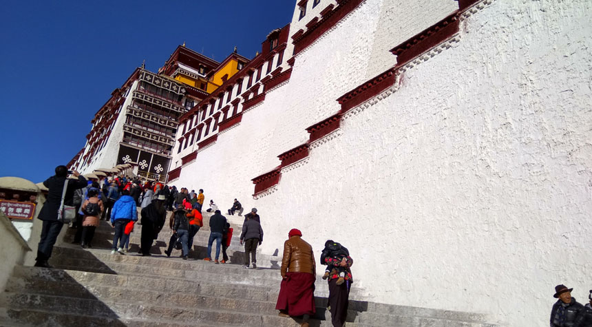 Climb steps to the Potala Palace